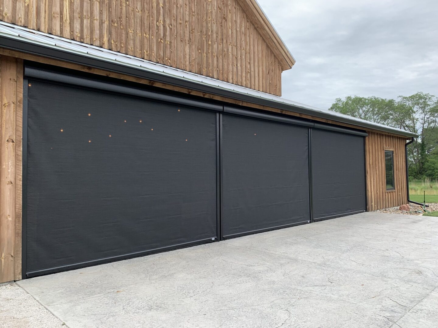 A garage door that has been opened up to let in the sun.