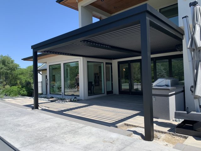 A patio with an awning over the top of it.