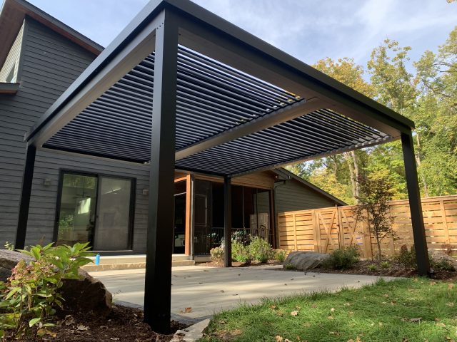 A patio cover that is open and has a metal frame.